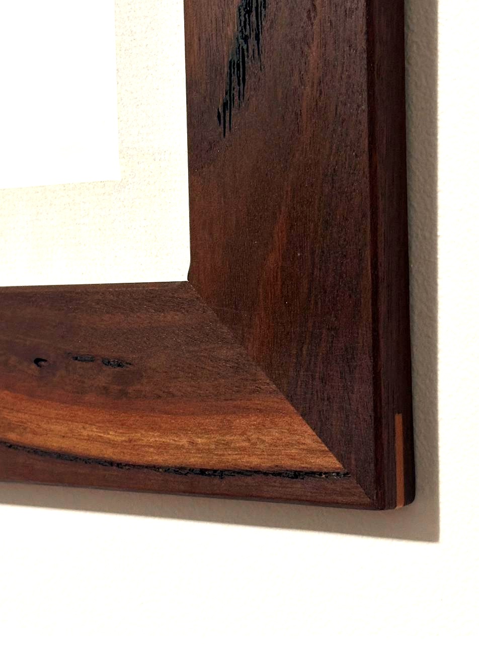 Jarrah frame corner — dark grain close-up