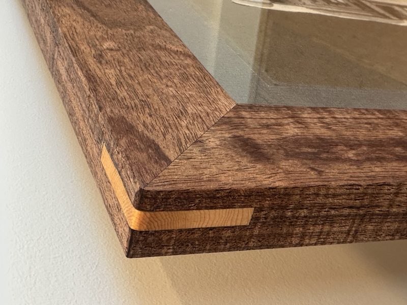 Blackwood frame corner with huon pine spline — tight mitre detail