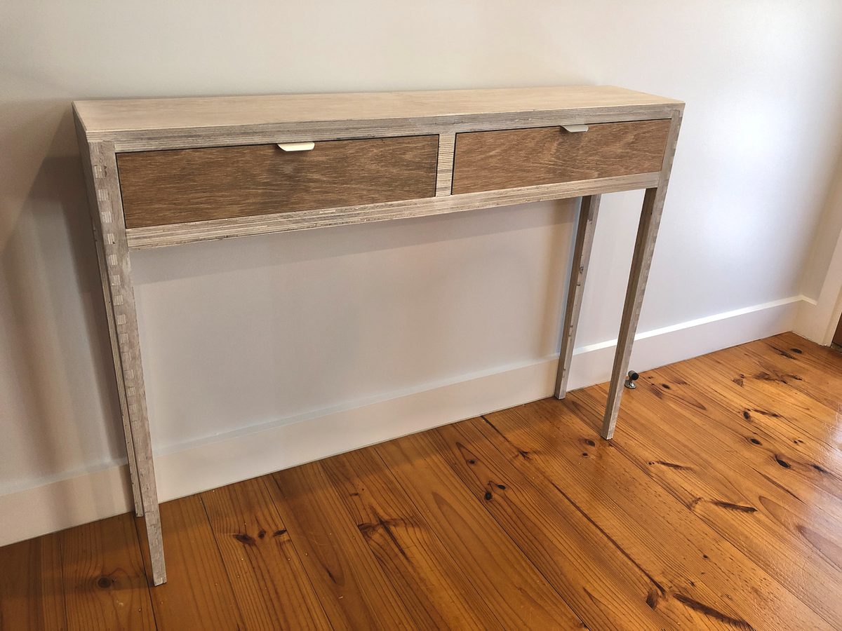 Console table in limed oak with refined legs